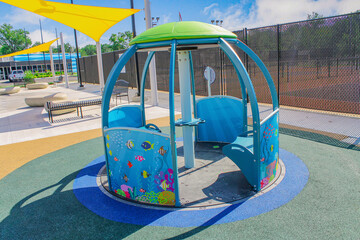 Circular rotating playground structure with shade canopy playground structure spinning roundabout recreation commercial facility landscape architecture children equipment colorful © SMHT ART WORKS