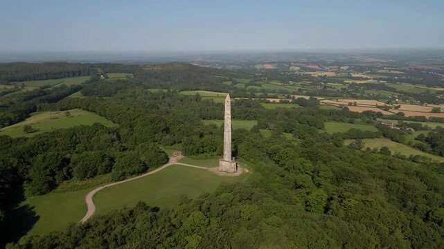 Wellington Monument perched on a hilltop within the Blackdown Hills. The camera slowly ascends, revealing the monument&rsquo;s full height and the panoramic views of the surrounding farmland.