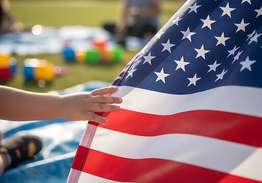 Child's Hand Touching American Flag Patriotism, Freedom, and Hope for the Future of USA
