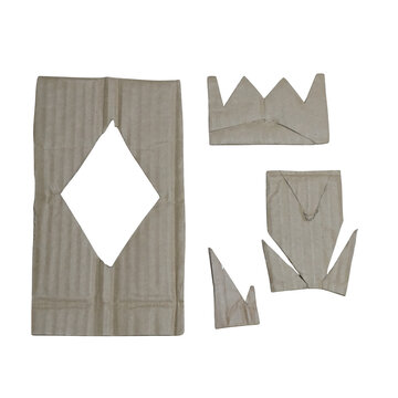 Four cardboard cutouts including a large rectangle with a diamond hole and three crown or jagged shapes on a solid isolated on a transparent background