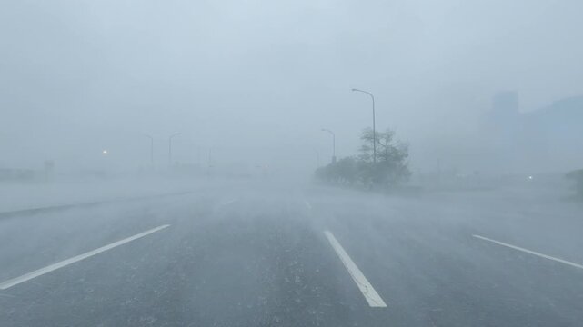 Driving Along City Highway In Powerful Hurricane Wind And Rain