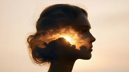 Woman portrait silhouette with double exposure sunset clouds for peace mindfulness © oksa_studio