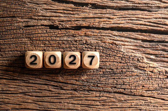 Wooden Blocks Forming the Year 2027 on Rustic Background