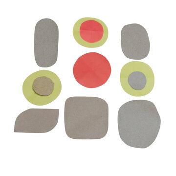 Assorted paper and cardboard shapes in various colors and textures arranged on a white background, including circles, squares, and rounded rectangles isolated on a transparent background