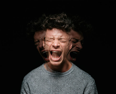 Anxiety and mental health struggle with a man screaming in emotional turmoil showing psychological pain and stress