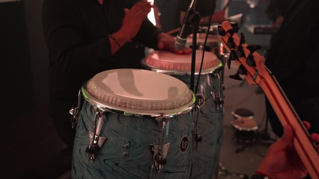 Salsa Orchestra Percussionist Playing Congas While People Dance in Cali, Colombia