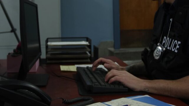 Police team in bullpen working on cases to solve crimes