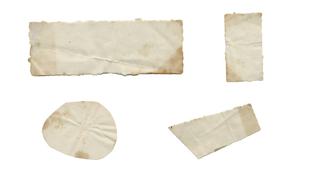 Set of four old, weathered, and torn paper scraps with rough edges and vintage texture, isolated on white background