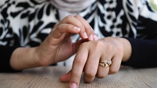 a young woman suffering itching skin in closeup,