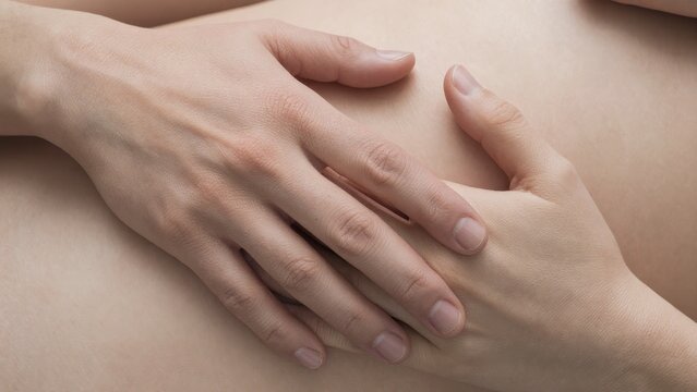 Intimate Moment of Hands Resting on an Expecting Mother&rsquo;s Belly