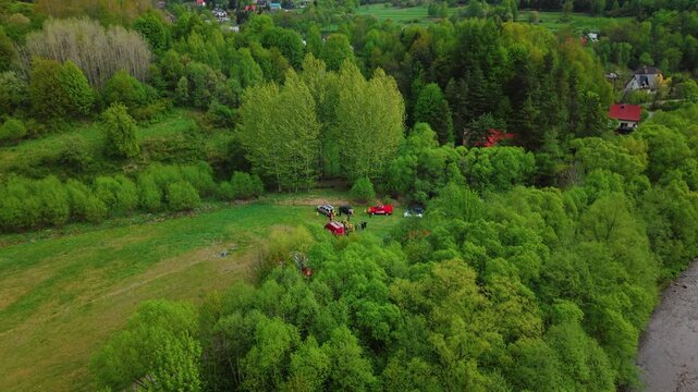 Aerial View of Firefighters Conducting Emergency Response Training in a Hilly Landscape