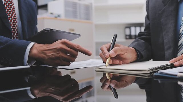Financial Businesswomen analyze the graph of the company's performance to create profits and growth, Market research reports and income statistics, Financial and Accounting concept.