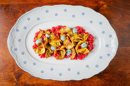 Delightful dish featuring vibrant colors and unique textures on a rustic wooden table