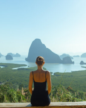 Woman Contemplating Scenic Phang Nga Bay Landscape at Sunrise