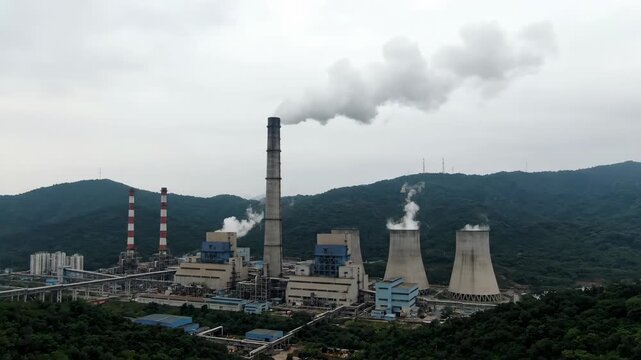 Panoramic view of the power plant, panoramic view of smoke coming out of the power plant chimney