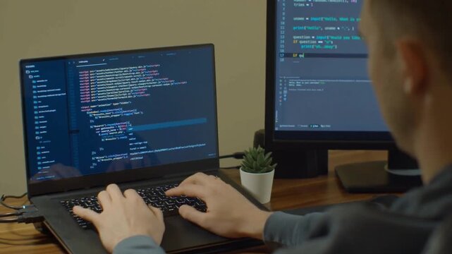 Close Up Programmer Hands Coding Website Software On Desktop Computer