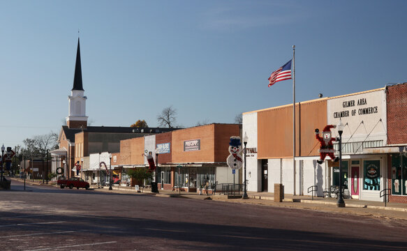 Gilmer TX - July 20, 2025: City Hall and Church Building Located in Downtown Gilmer, TX