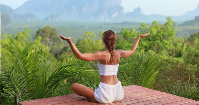 Zooming Out Rear View Woman Doing Morning Yoga With Krabi Mountain Vista