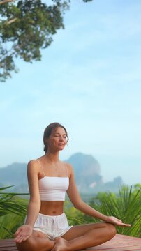 Mindful Breathing Exercise By Woman In Lush Thai Landscape