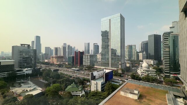 High angle timelapse of Jakarta skyline and highway traffic along Sudirman, Indonesia