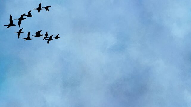 Animated Silhouette of Flock of Birds Flying in V-Formation Across Blue Cloudy Sky 4K Stock Footage