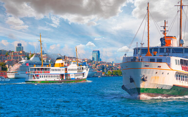 Fototapeta premium Cruise ship and ferry (steamboat) traffic in the Bosphorus - Sea voyage with old ferry (steamboat) on the Bosporus - Coastal cityscape with modern buildings under cloudy sky - Istanbul, Turkey 