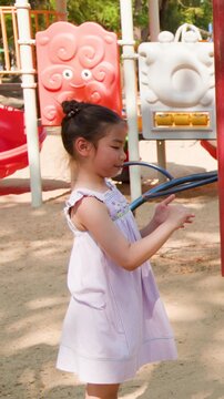 Young Thai Girl Playing Games at Lumpini Park Playground