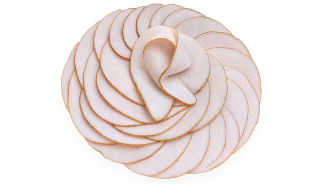 A top down view of thinly sliced turkey breast meat arranged in a circular flower pattern isolated on a clean white background transparent background