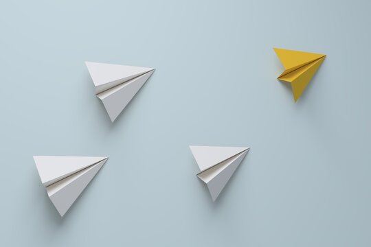 Yellow paper plane leading group of white planes