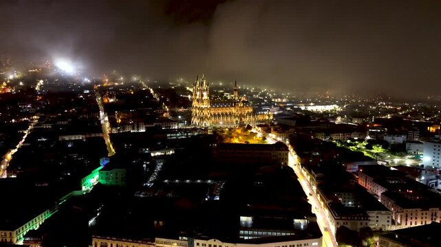 Foggy Night View of Quito Ecuador Historic Basilica and City Lights, Dramatic Low Clouds, Streets and South American Capital Skyline