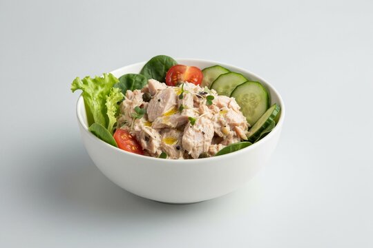 High-end 3D realistic render of a healthy tuna salad with leafy greens and cucumber, minimalist white ceramic bowl, cool natural daylight, clean light gray background, realistic tuna and vegetable tex