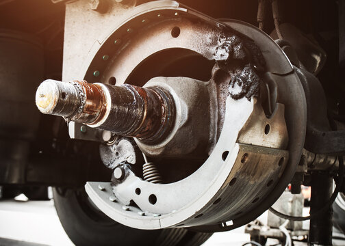 Disk brake truck trailer maintenance, brake pads, truck axles. semi trailer truck wheels repair. freight transportation