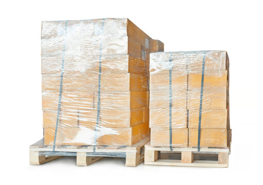 Package Boxes Wrapped Plastic on Pallets. CardBoard Boxes on White Background.  Shipping. Logistics Warehouse. Supplies, Supply Chain Shipment Goods. Distribution Warehouse Logistics.	
