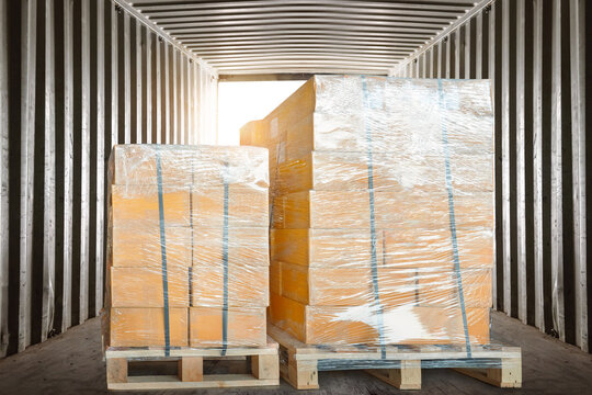Bulk of package boxes shipment. goods loaded into shipping containers. distribution warehouse shipping, cargo shipment. freight transportation logistics	
