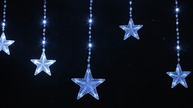 Glowing starshaped christmas lights hanging in swags against a dark night background for festive decoration