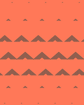 Graphic charcoal chevrons increase and decrease in scale across