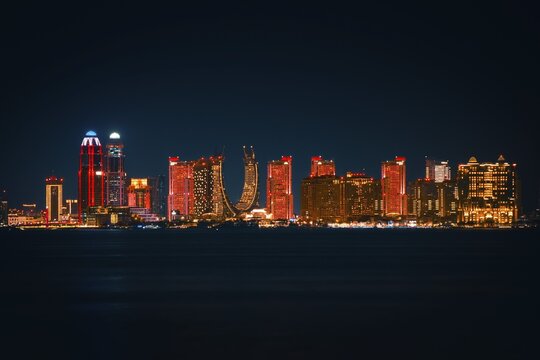 Doha, Qatar - january 8th, 2026: Panorama Lusail skyline night. Iconic Katara Towers, Marina district skyscrapers. Modern Qatar architecture, glowing city lights, urban horizon