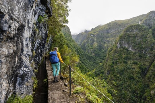 Hiker on a Levada, PR9 Levada do Caldeir&atilde;o Verde, Madeira, Portugal