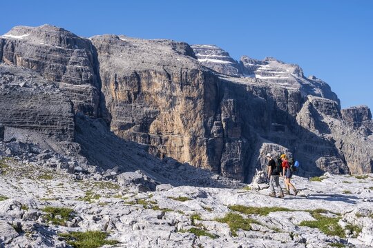 Two mountaineers on a hiking trail on the Grost&eacute; Plateau, Brenta Mountains, Parco Naturale Brenta-Adamello, Trentino, Italy