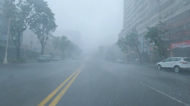 Driving  In Powerful Hurricane Eyewall Wind And Rain In Downtown Urban Area