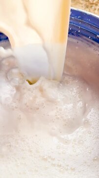 Milk Splash Animation in a Blue Glass, Dynamic Pouring Motion