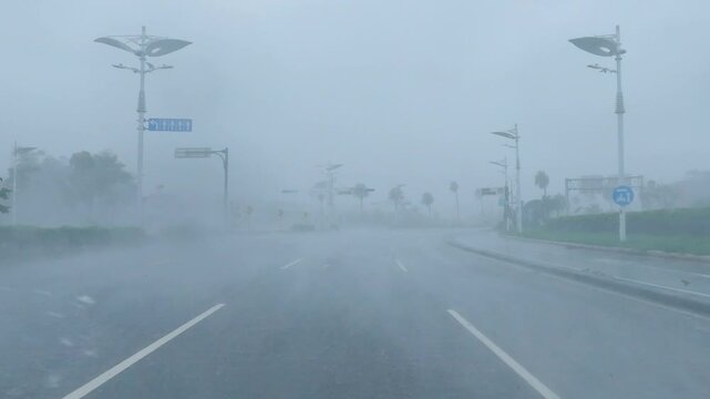 Hurricane Force Winds Drive Heavy Rain Across City Highway
