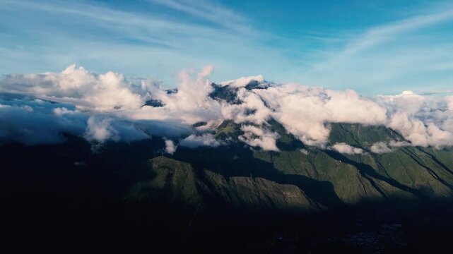Aerial View of Andean Mountain Ridge in Ecuador with Clouds, Blue Sky, Green Slopes and Scenic High Altitude Nature Travel Landscape
