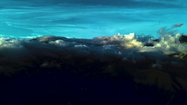 Moody Sunset Over Andean Mountain Ridges in Ecuador with Dark Forested Slopes, Cloud Layers and Dramatic High Altitude Landscape Background