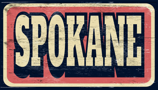 Aged and worn Spokane sign on wood