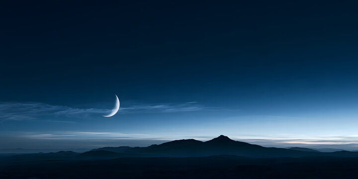 Serene night landscape with crescent moon over distant mountains
