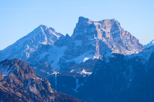 Telephoto view of striking Dolomite summits showcasing intricate rock textures and pristine snowfields