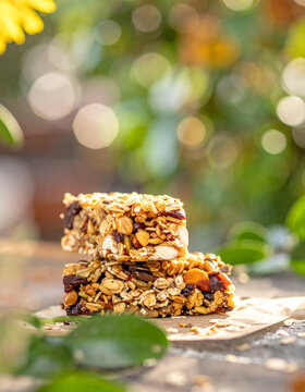 Tasty and healthy homemade organic granola protein bar with oats and seeds. Delicious vegan snack. Appetizing food. Close-up.