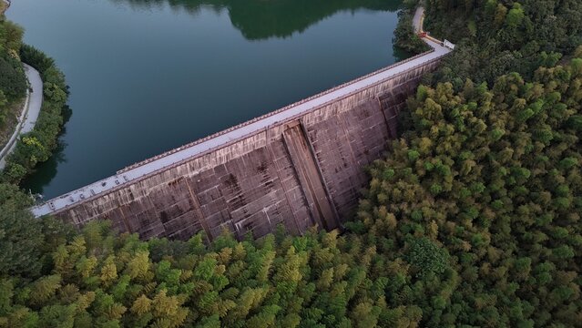 Aerial view of a dam separating the waters during golden hour