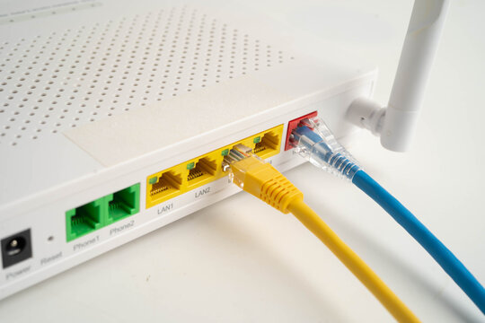Ethernet cable with wireless router connect to internet service provider network.